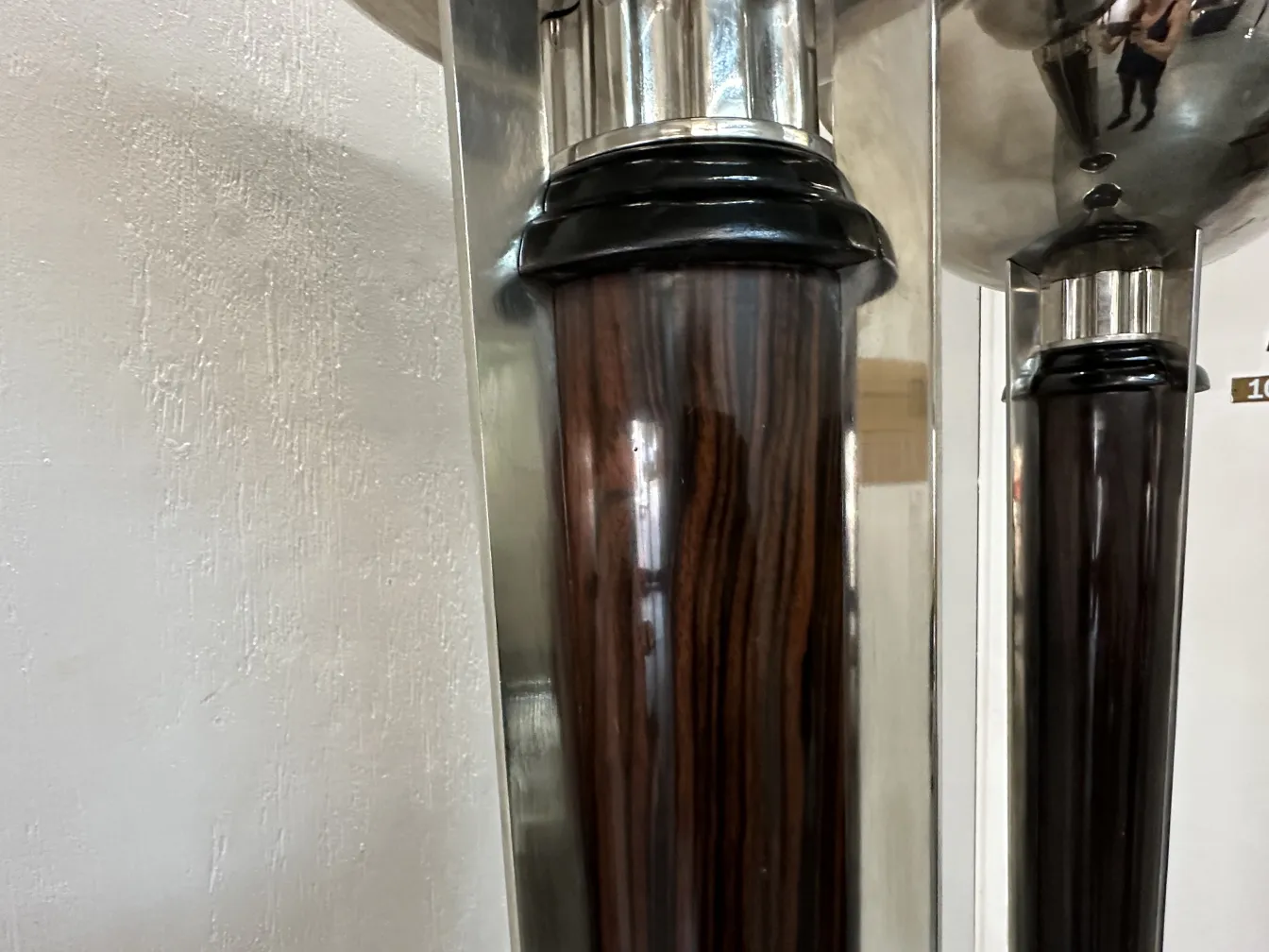 Detail of 2 stylish antique floor lamps in a setting