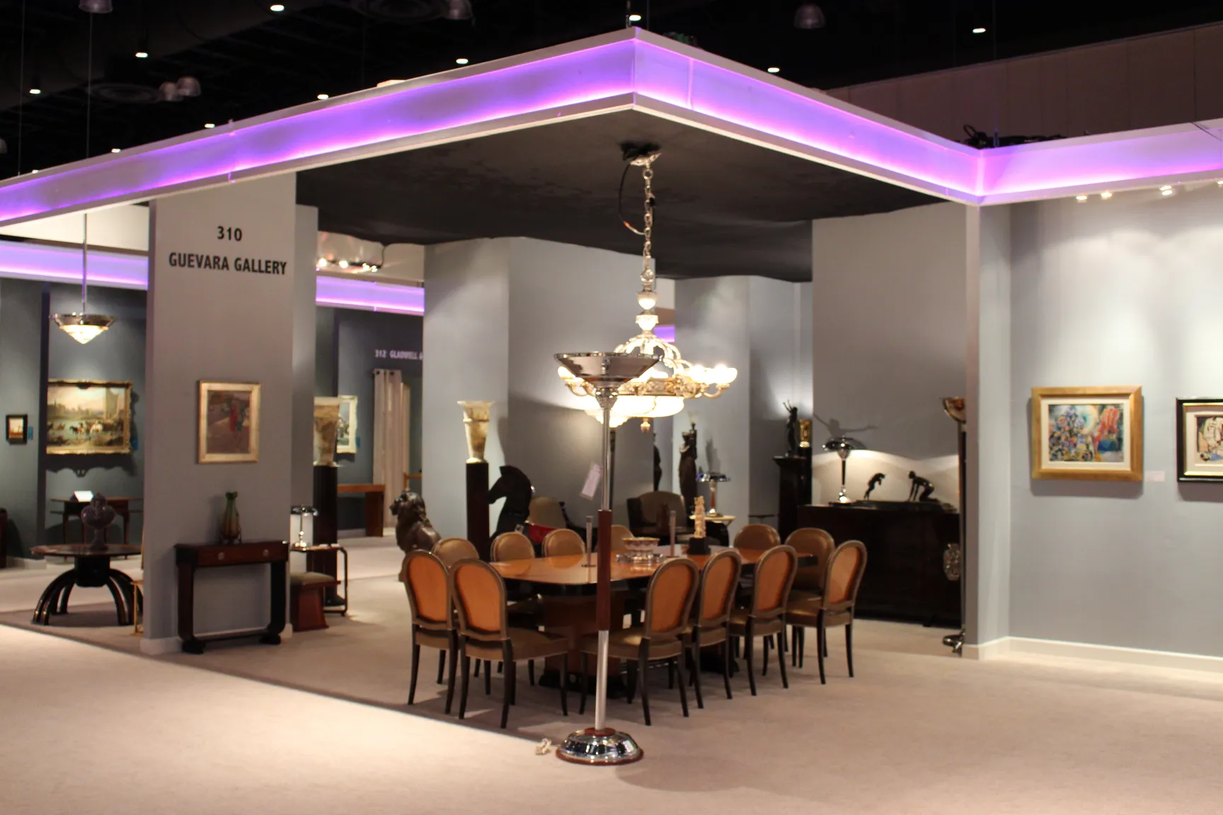 two antique floor lamps in a gallery with decorative surroundings