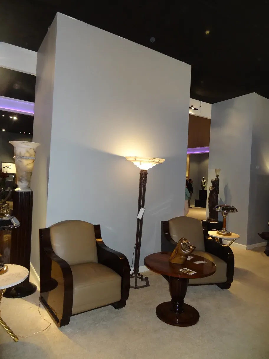 Two antique floor lamps in an elegant room with stylish furniture