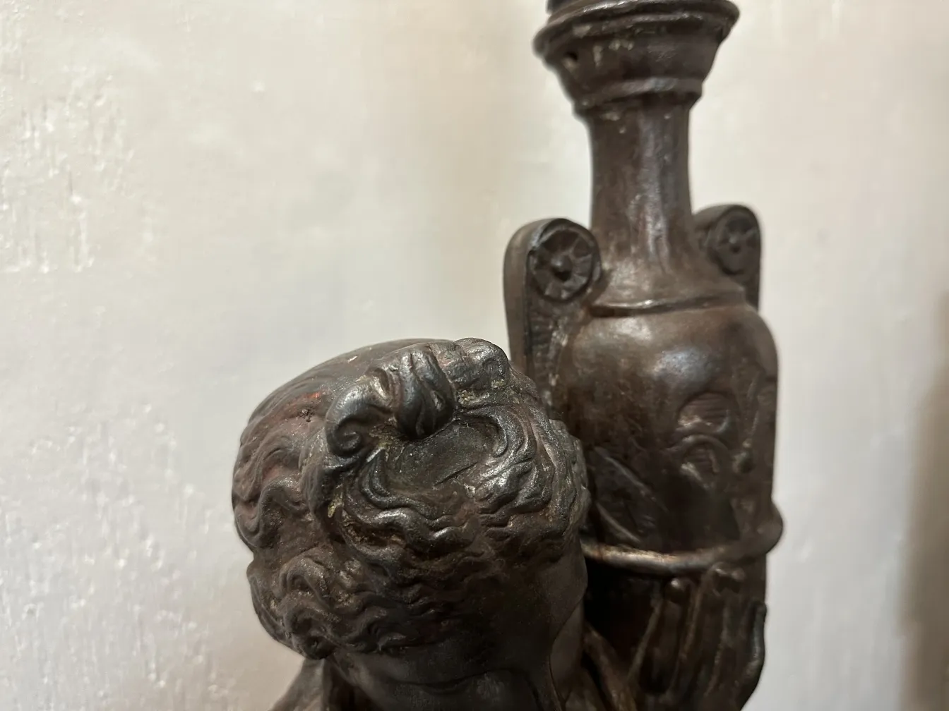 two decorative antique floor lamps in setting