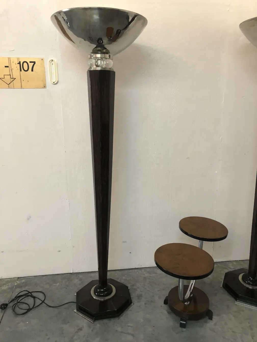 two antique floor lamps in decorative setting