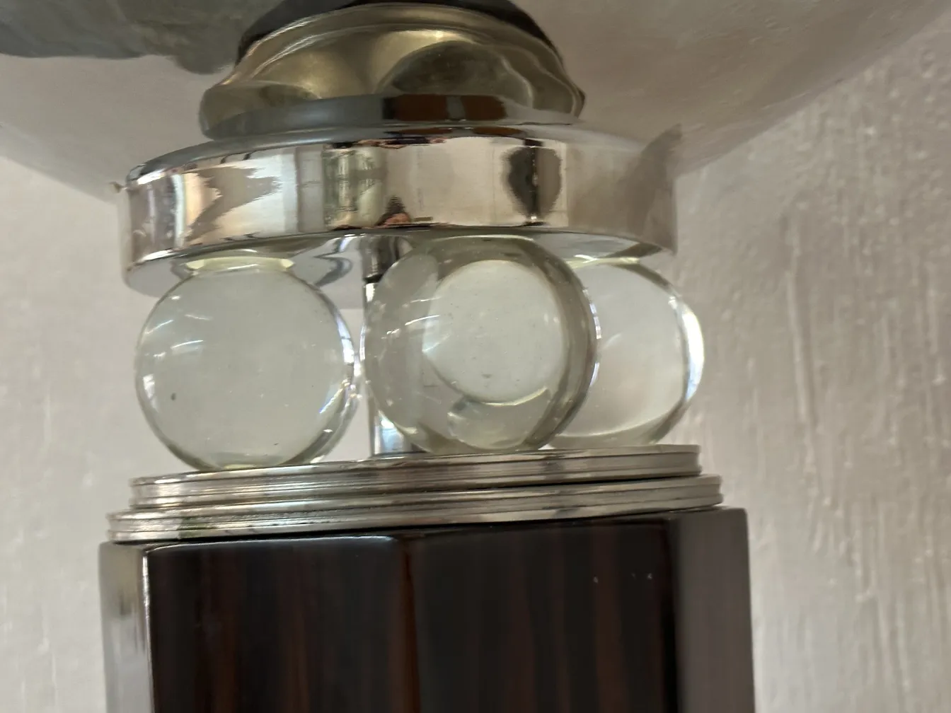 Two antique floor lamps with decorative details on an elegant base