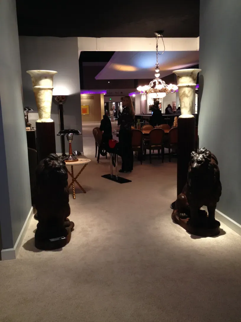 Two antique floor lamps in a stylish environment with decorative details.