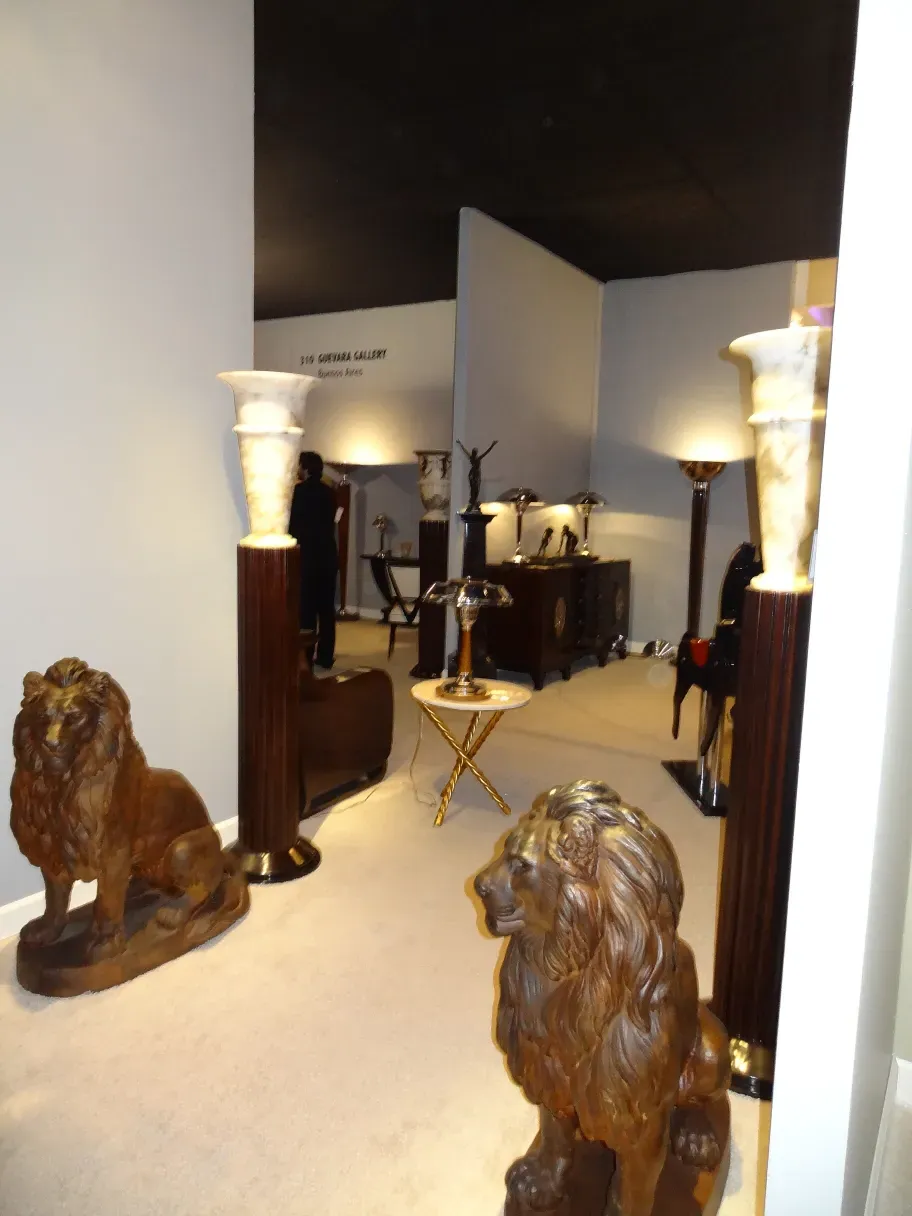 Two antique floor lamps in a decorative setting