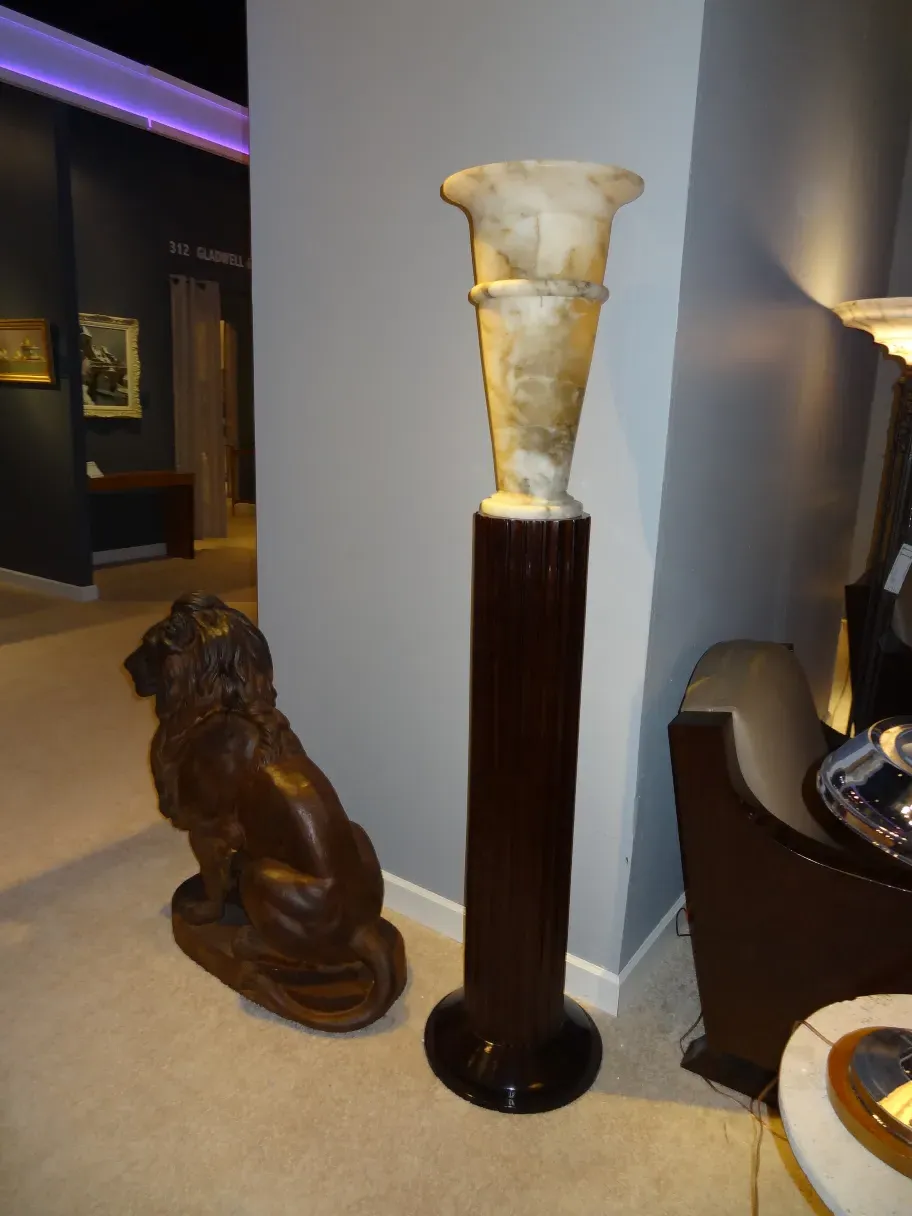 Antique floor lamps with decorative base and soft light in an elegant setting