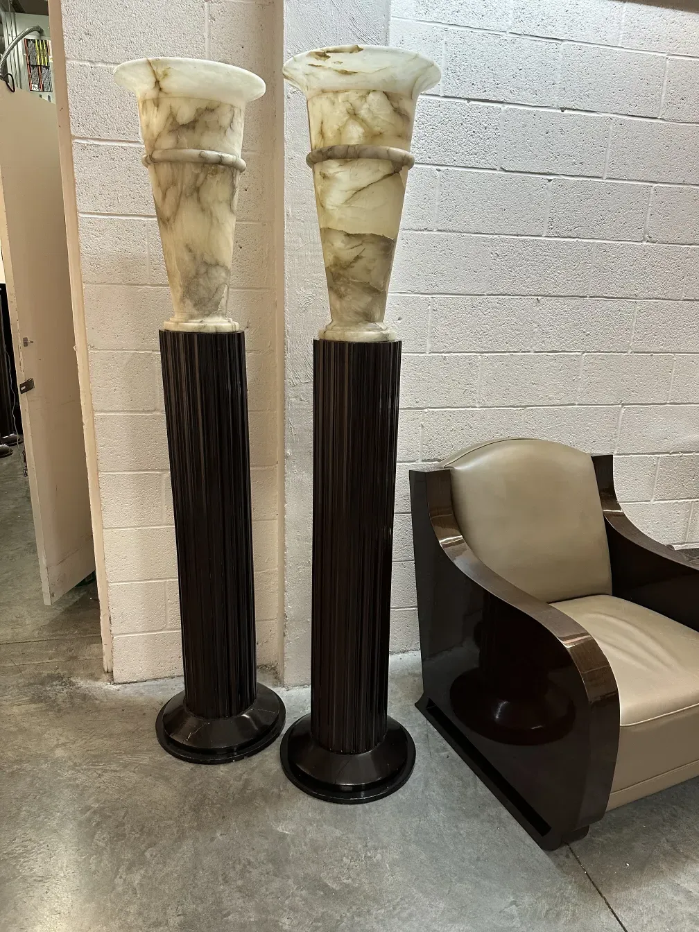 image of 2 antique floor lamps with decorative details in a neutral setting