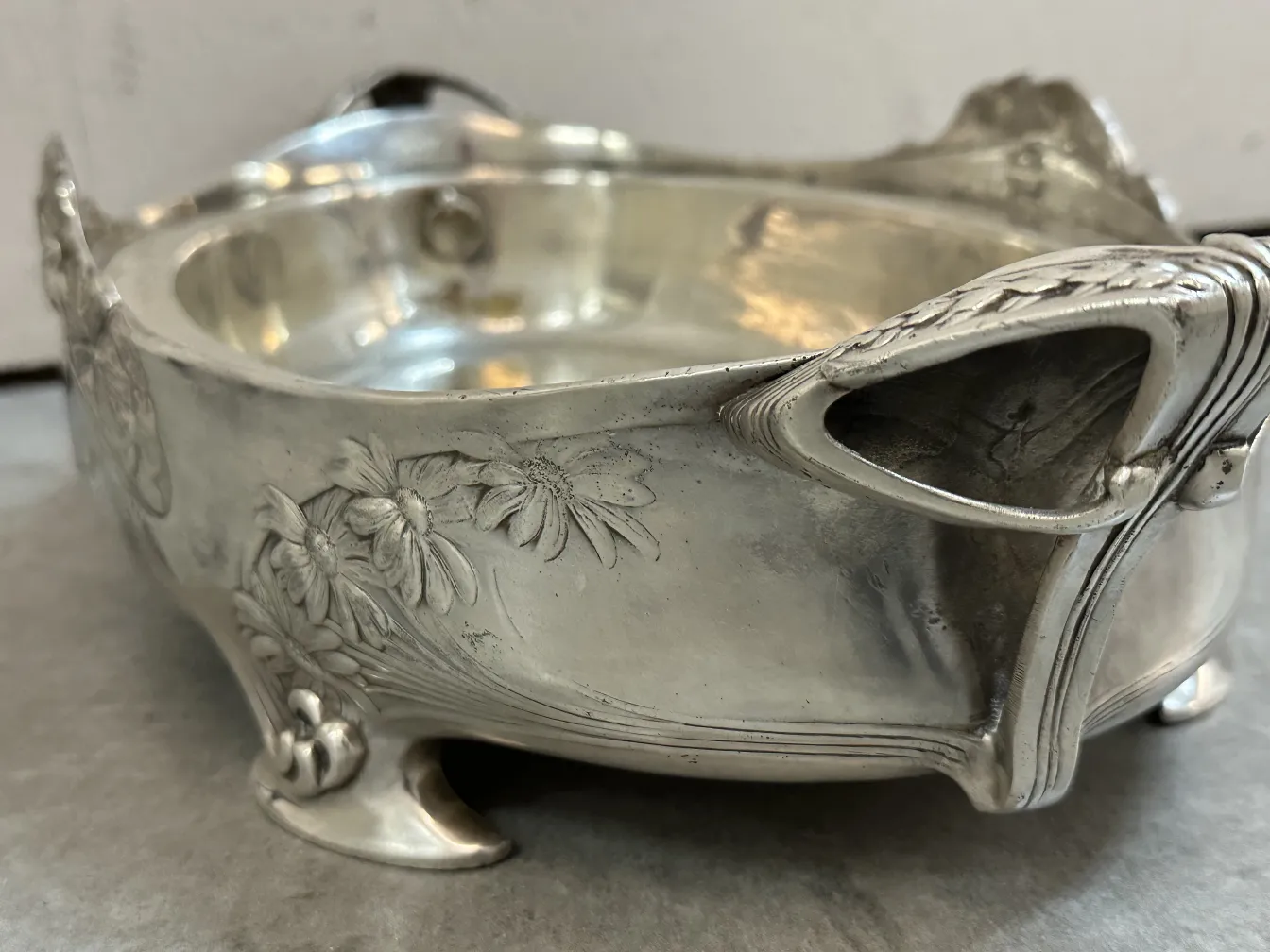 Antique Gallia centerpiece with intricate relief designs and elegant feet.