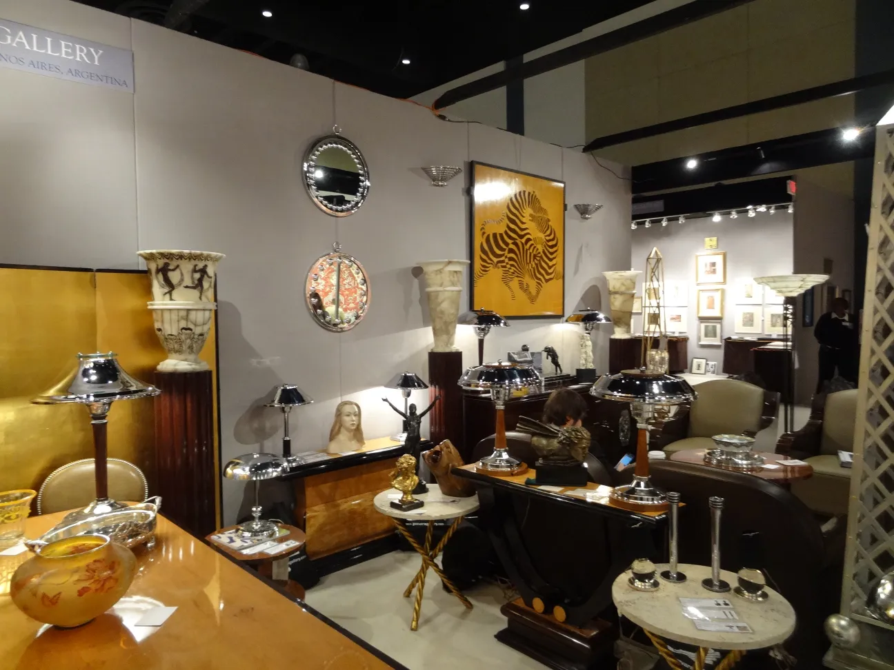 antique exhibition featuring marquetry and various decor items