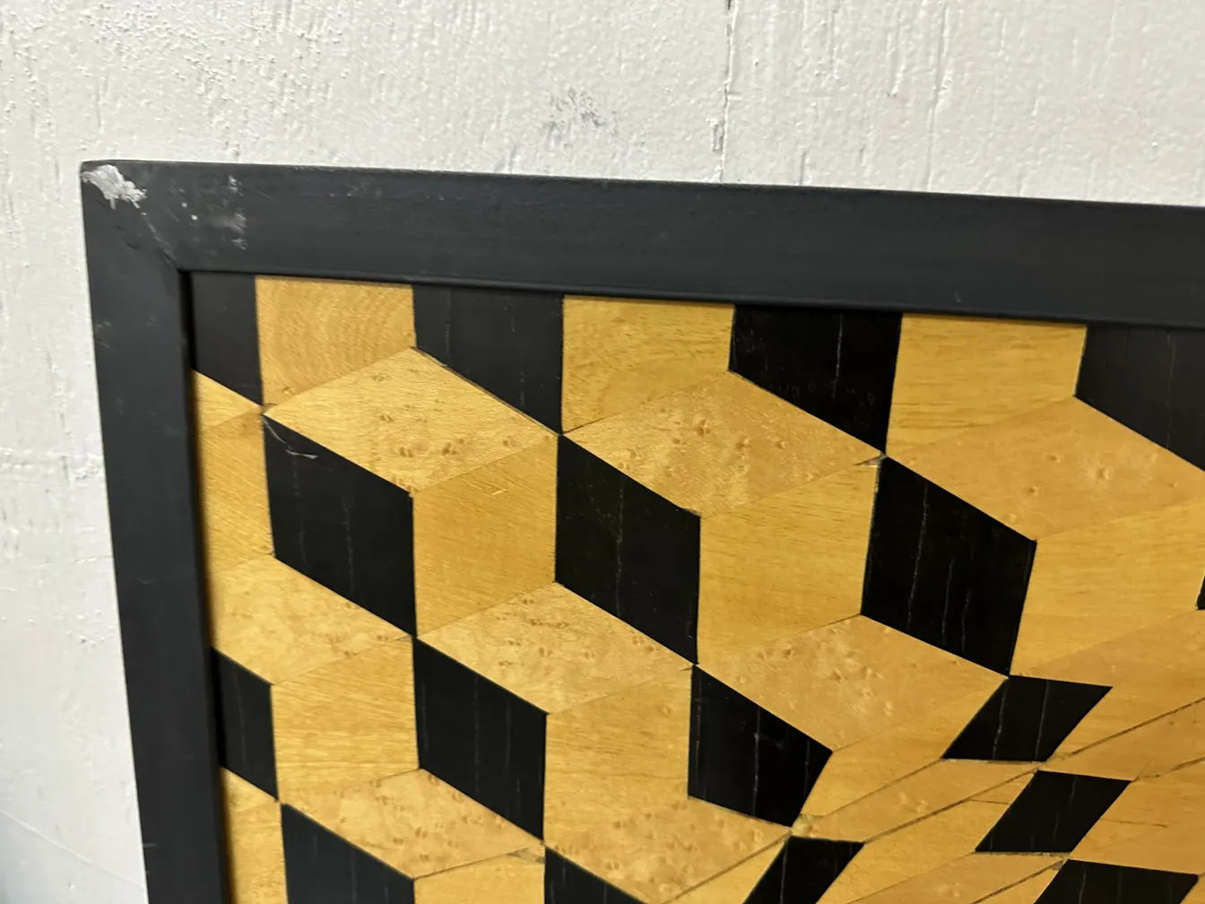 detail of antique marquetry with geometric patterns in light and dark tones