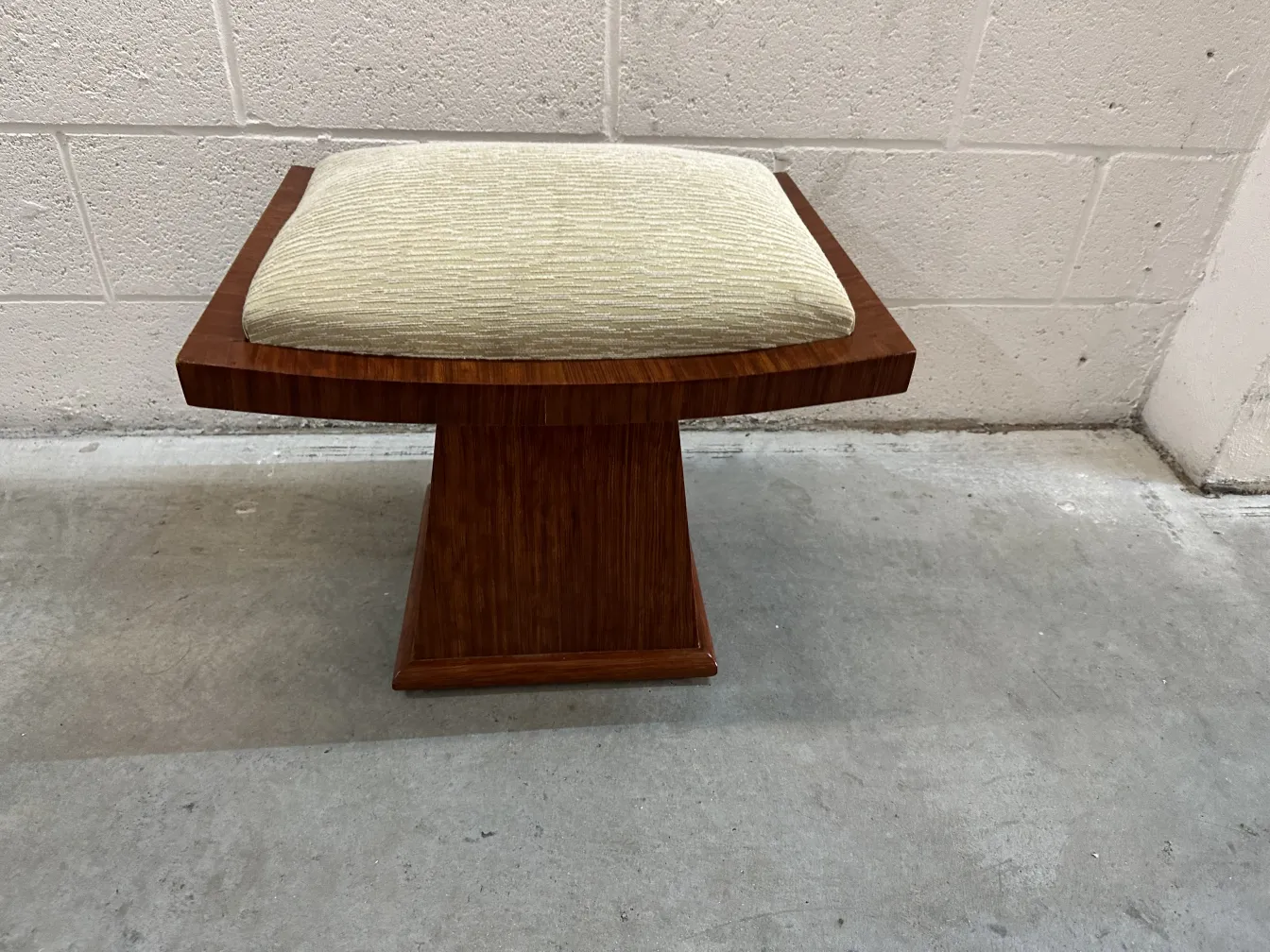 antique stool with cushioned seat and elegant look