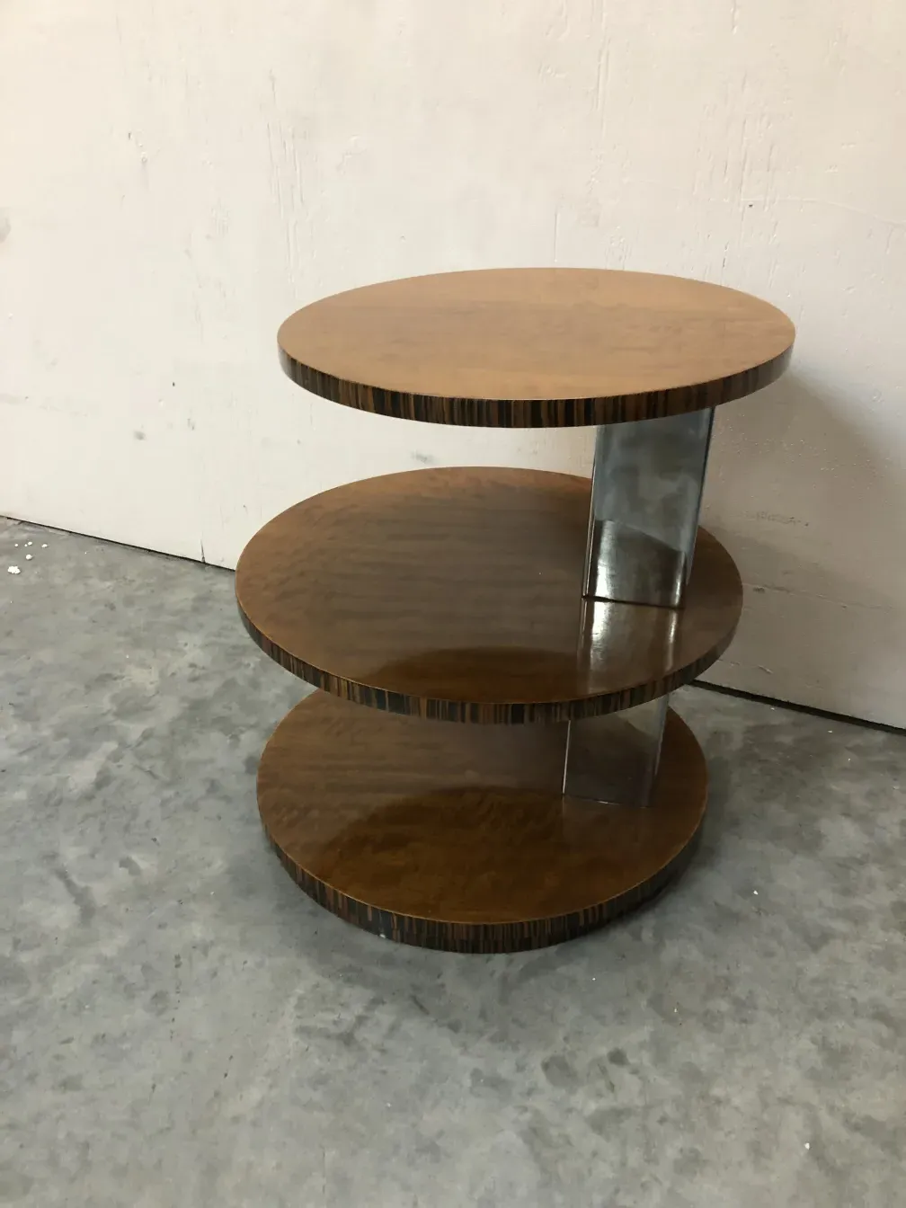 antique small table with a round top and metal base