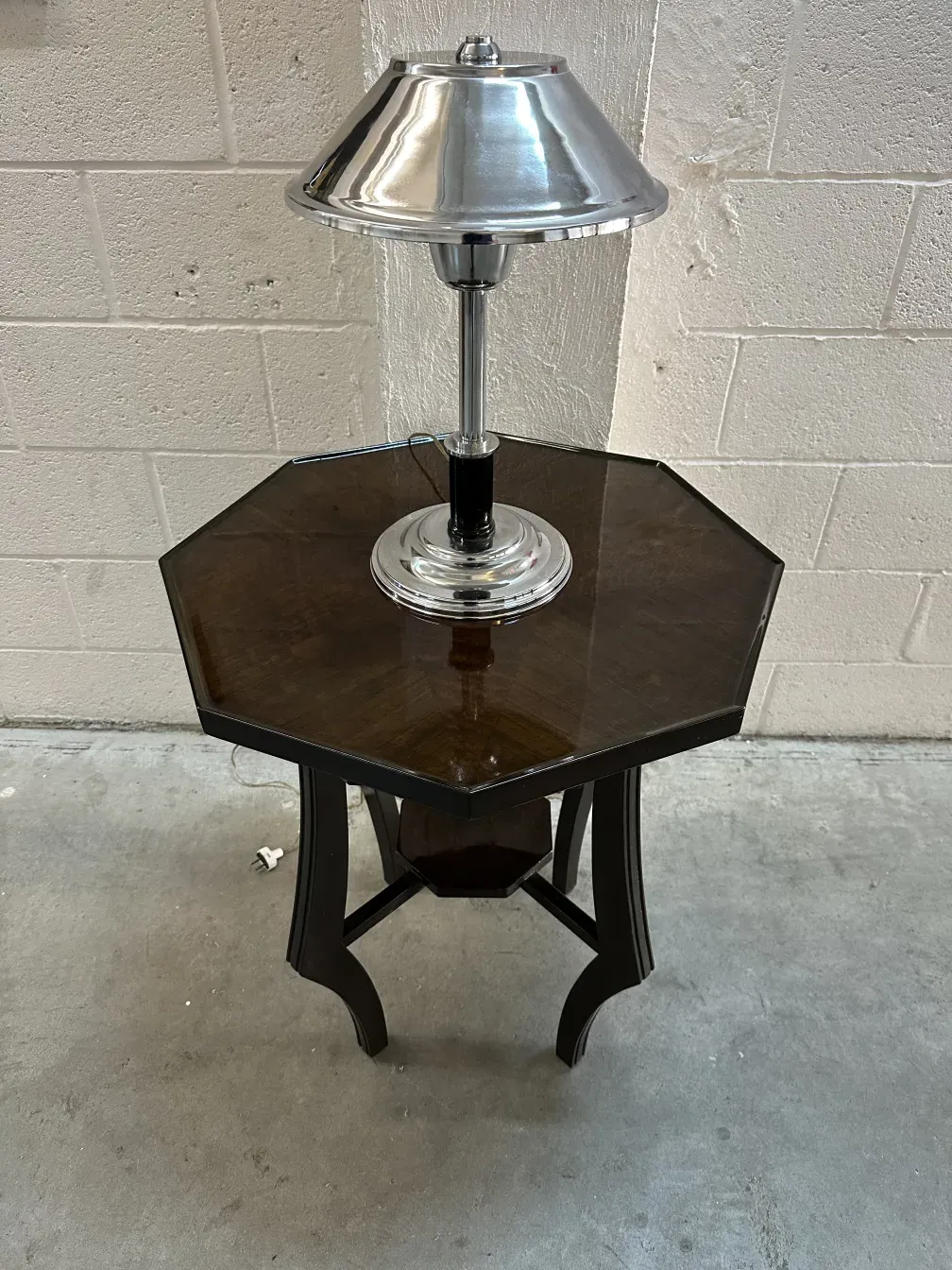 antique octagonal small table with silver lamp