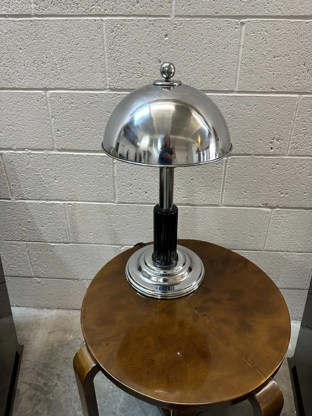 antique small table with shiny lamp in a cozy setting