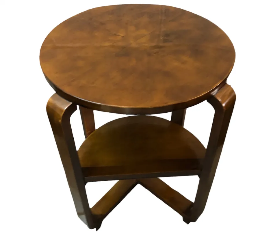Antique small round table with a lower shelf.