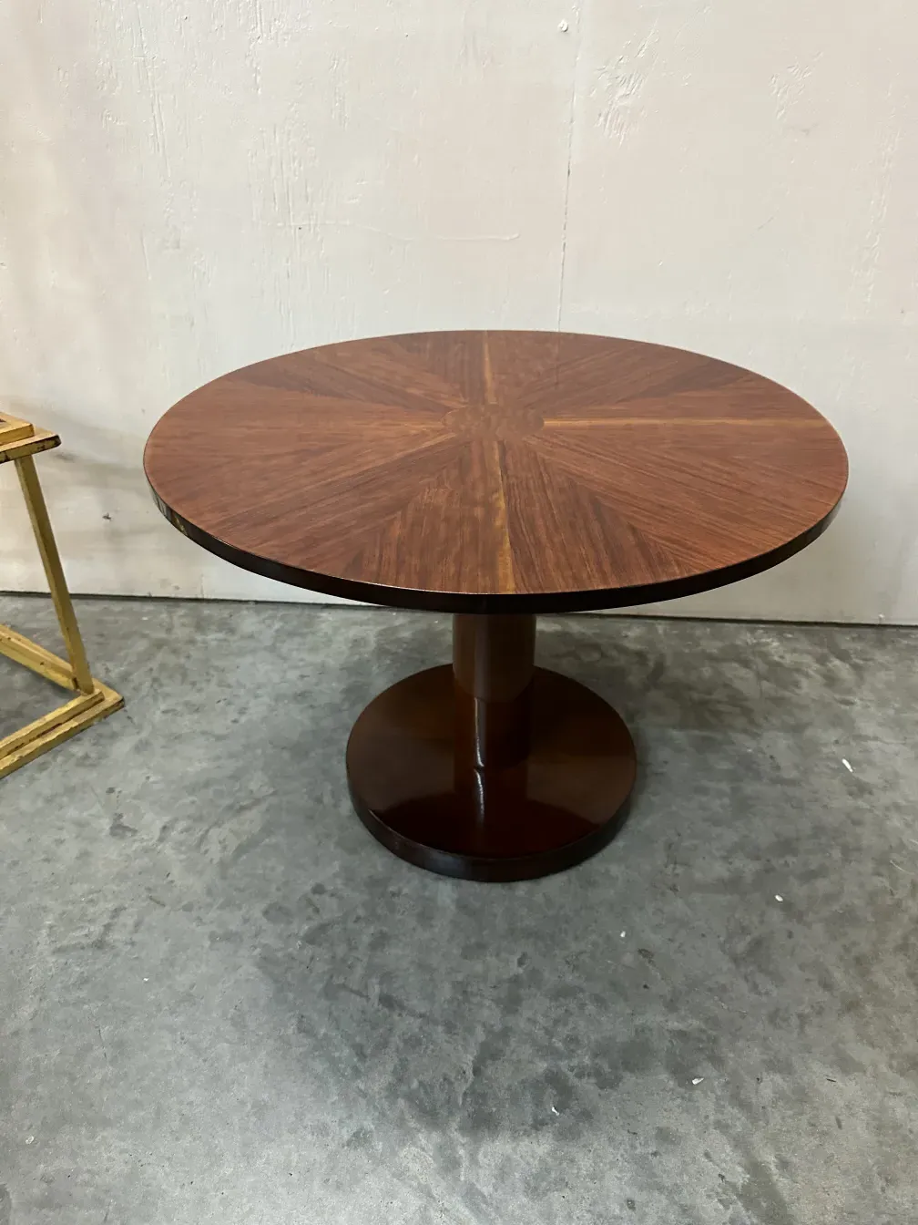 antique round small table with elegant base, classic design