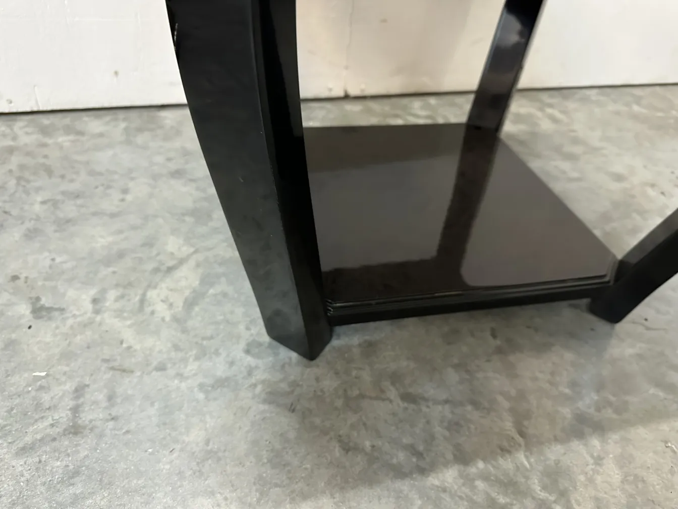 Side view of two elegant antique small tables