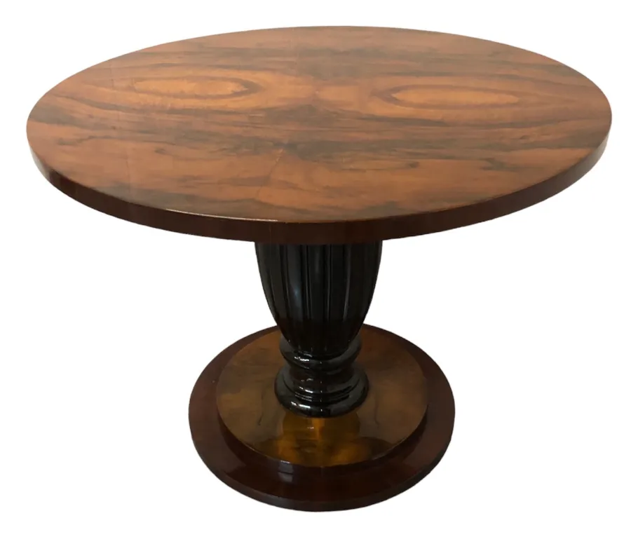 View of two antique round tables with black base