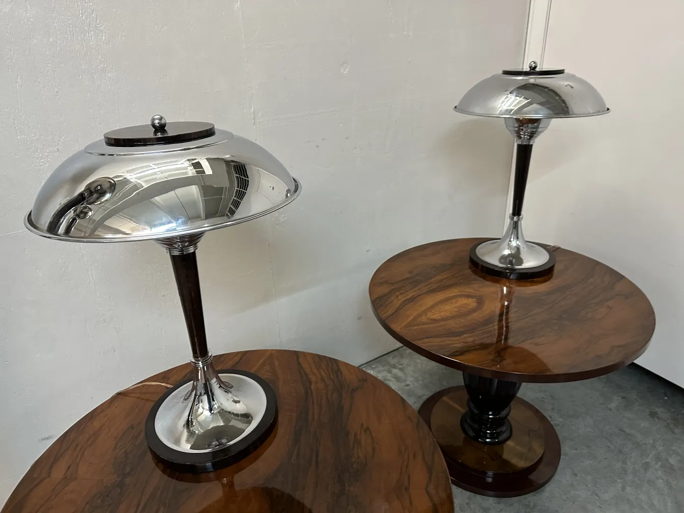 Two antique small tables with round bases and elegant details