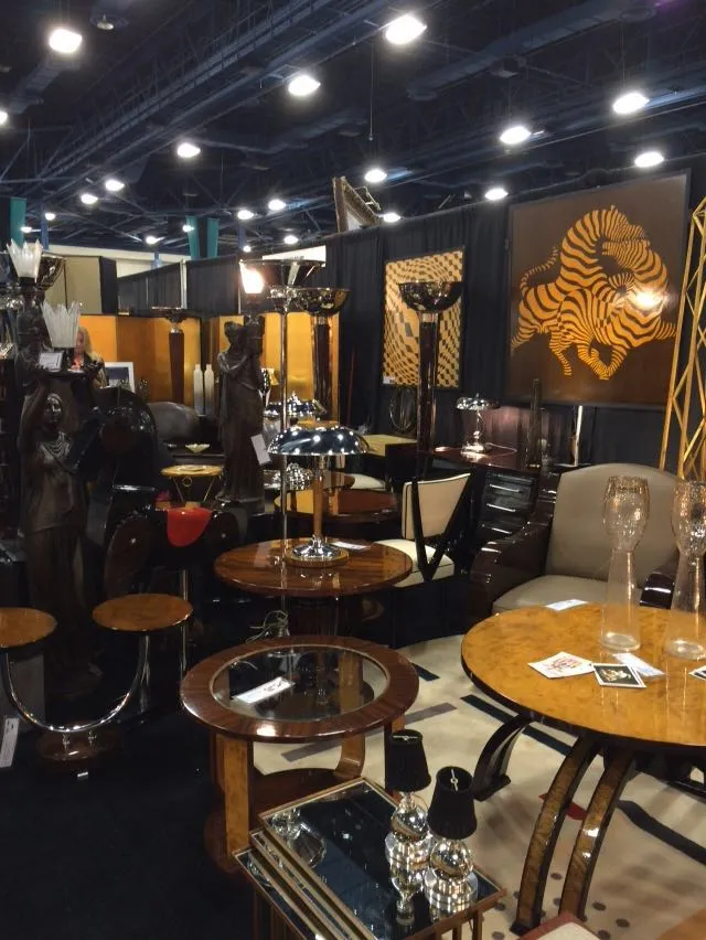 A pair of antique tables displayed at an antique fair