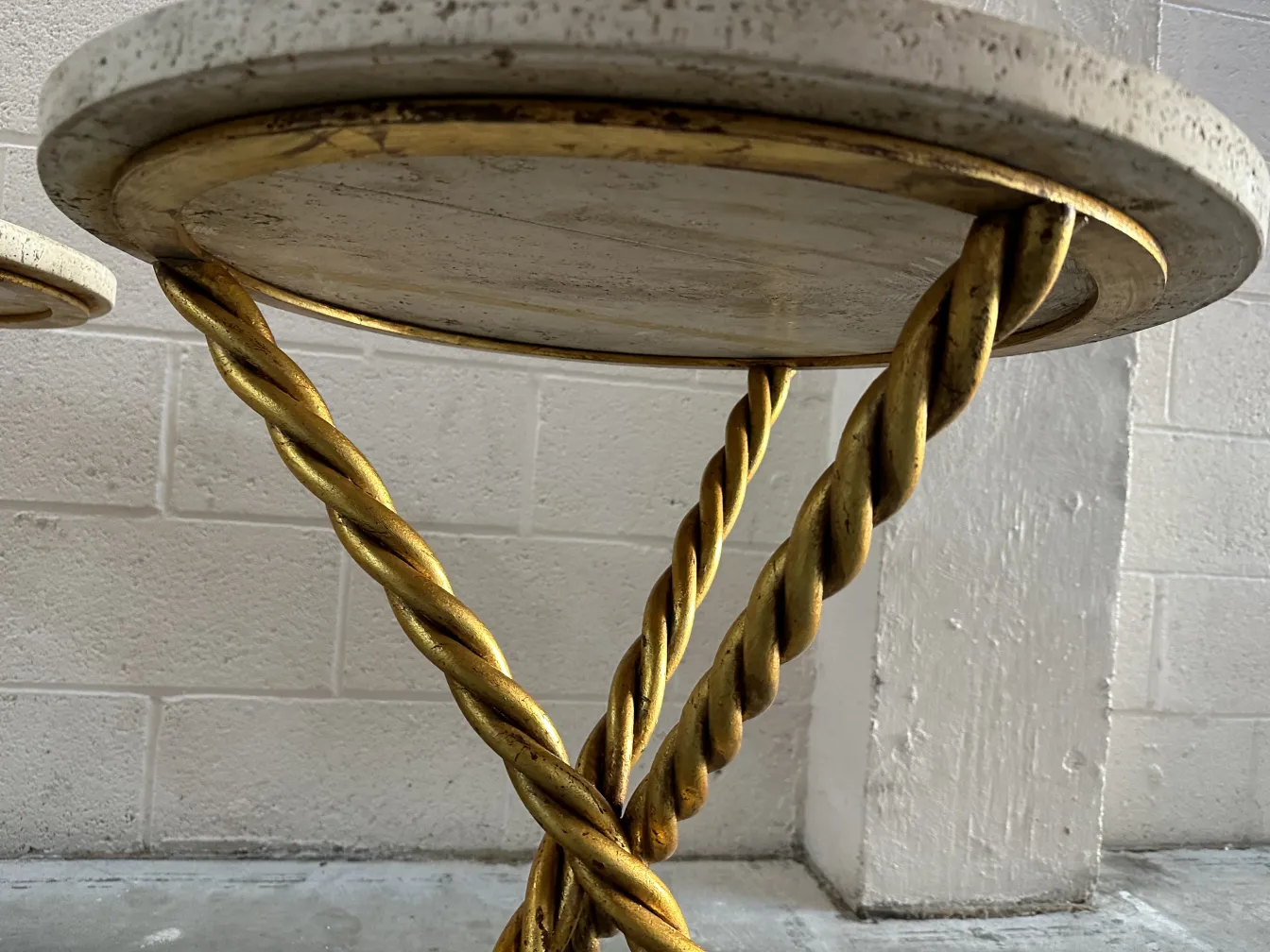 2 antique small tables with twisted golden legs and light surface