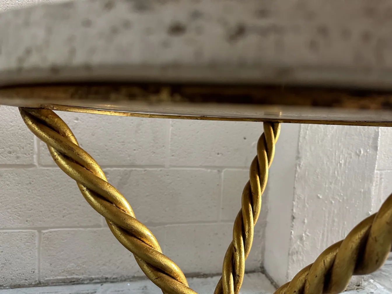 Antique small tables with golden base and twisted design