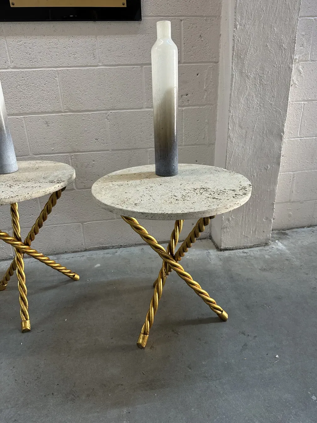 two antique small tables with golden twisted bases and round tops