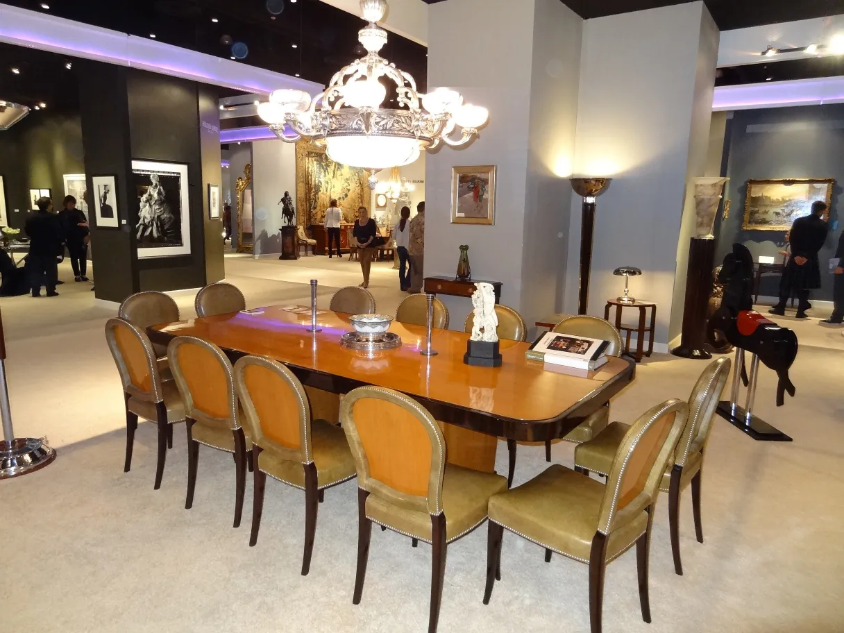 Two antique candelabras with refined detail in an elegant setting