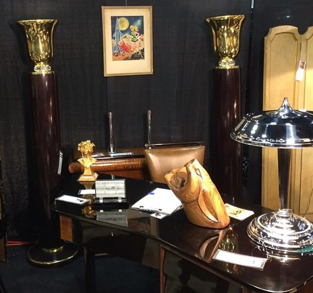 Image of 2 antique candlesticks maison desny on a table, in an elegant setting