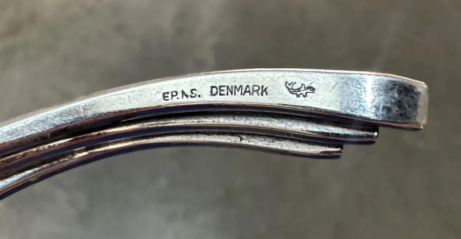 two antique candle holders with unique design