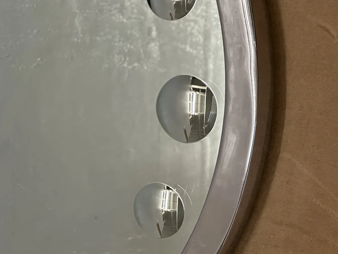 antique mirror with unique details and distinctive shape on the wall