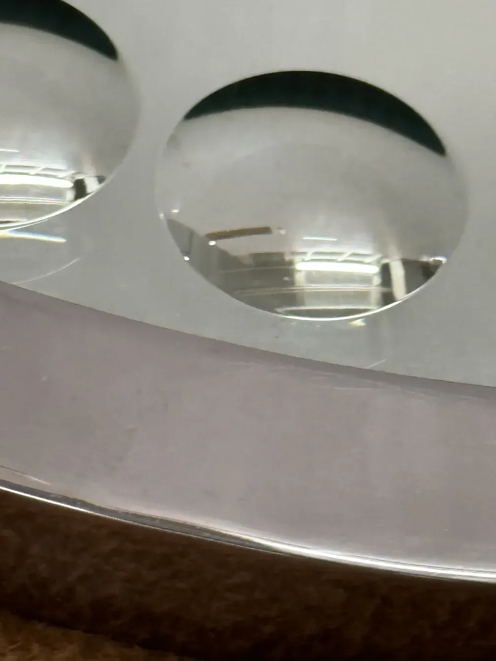 close-up of 2 antique mirrors in a warm setting