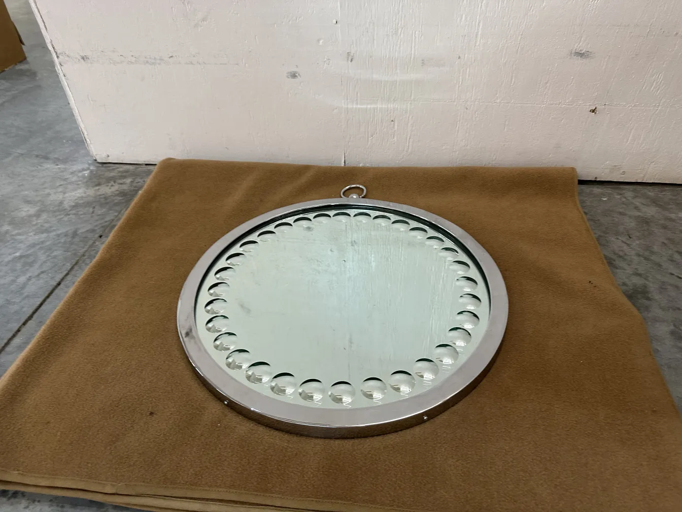 two round antique mirrors with decorative details