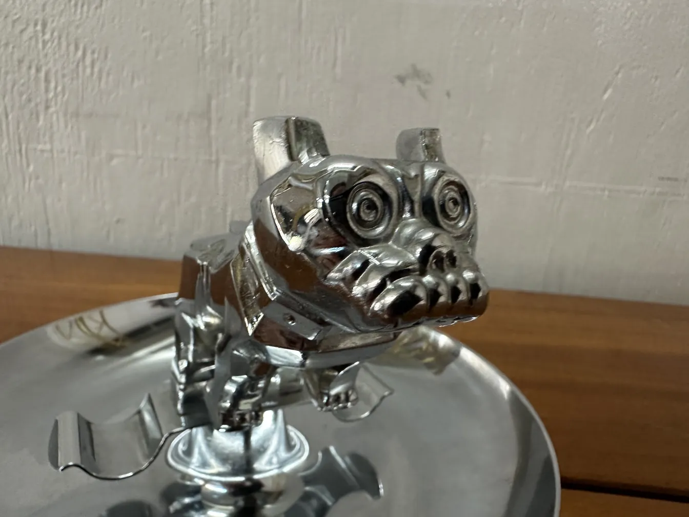Antique ashtray with dog figure, shiny surface