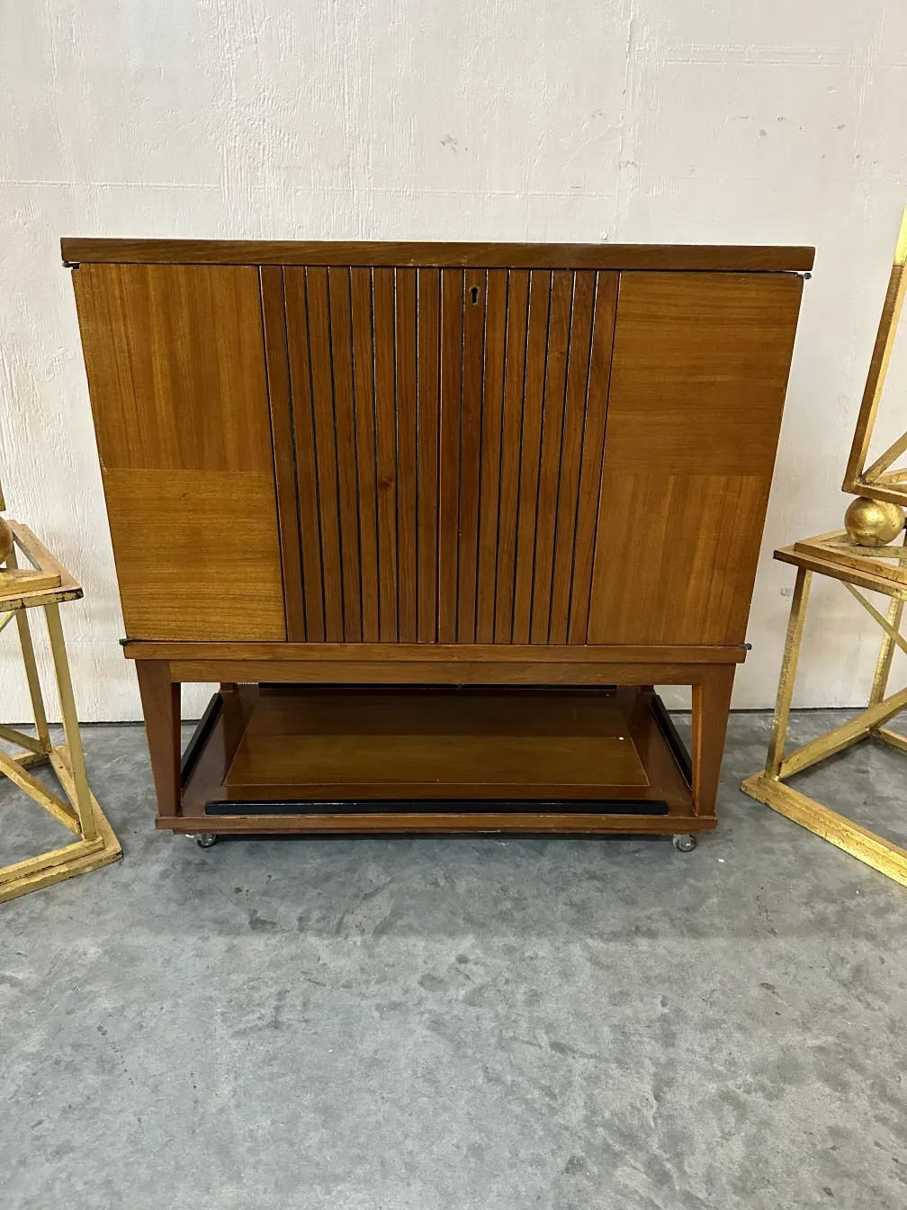 Antique bar cabinet with door details and elegant background. View of the environment with other objects