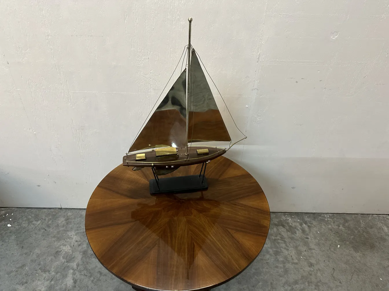 antique designer's ship model displayed on a black base