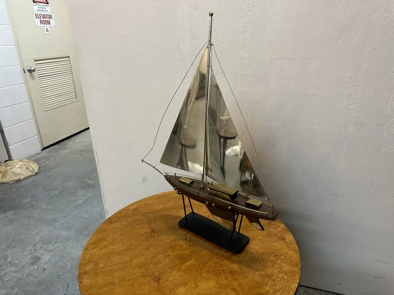 Antique designer's ship with sails on a table