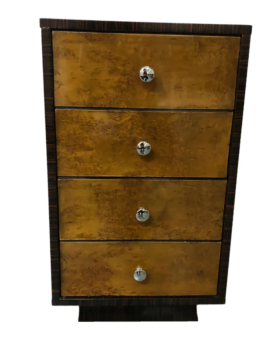 Antique cabinet with four drawers and shiny handles