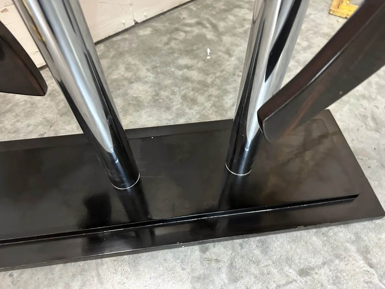 antique horse sculpture on a shiny dark pedestal