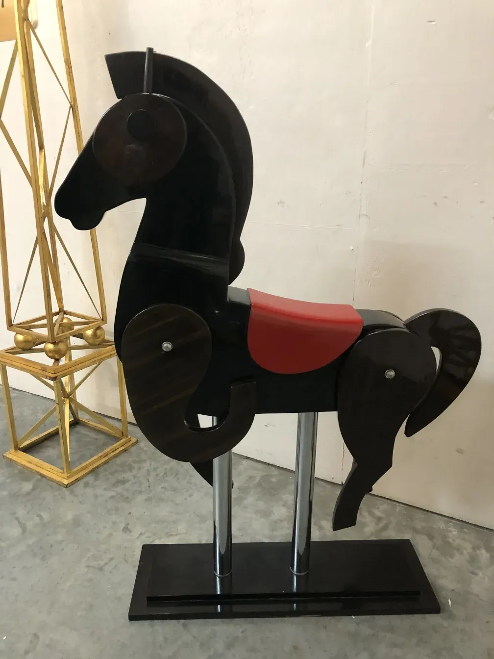 antique horse with a red seat and stylish design