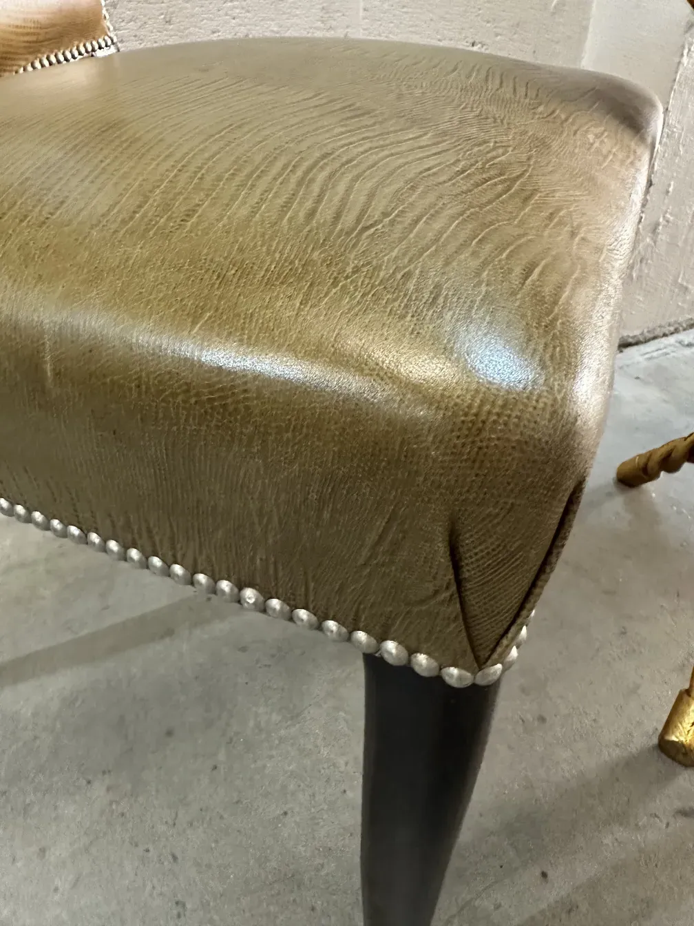 Close view of 12 antique chairs with ornaments