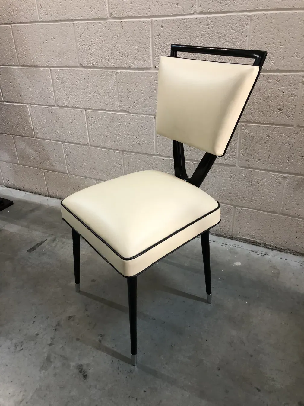 two antique chairs designed by carlo mollino with a unique style