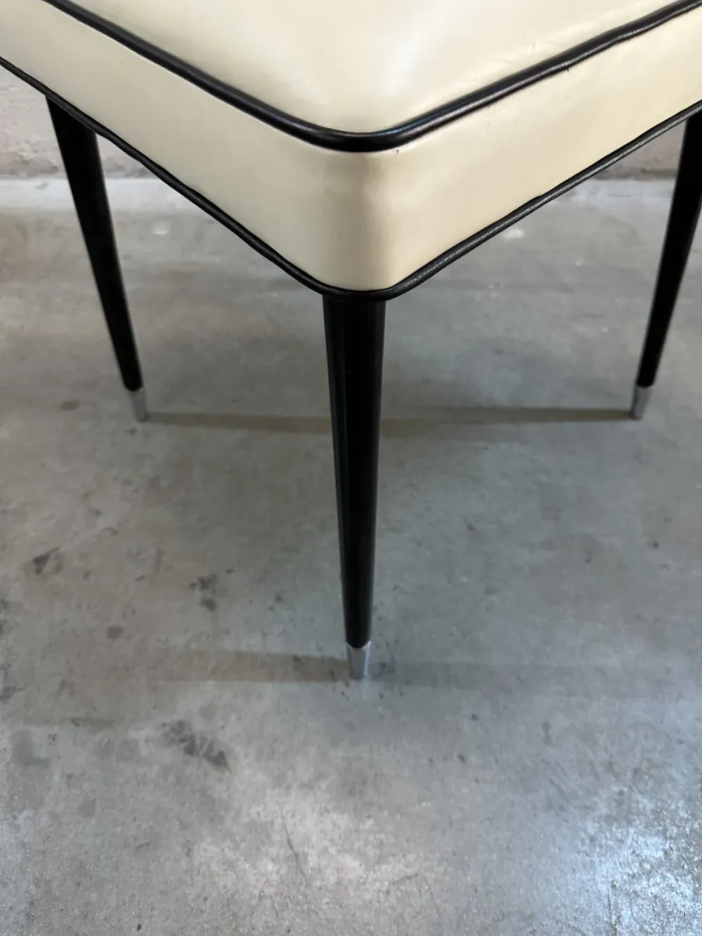 2 antique chairs featuring elegant legs and contemporary design.