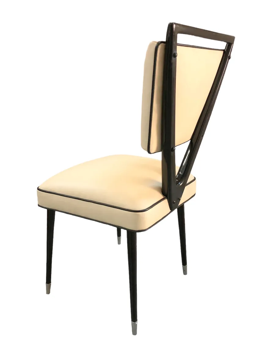 Two antique chairs featuring an elegant design carlo mollino