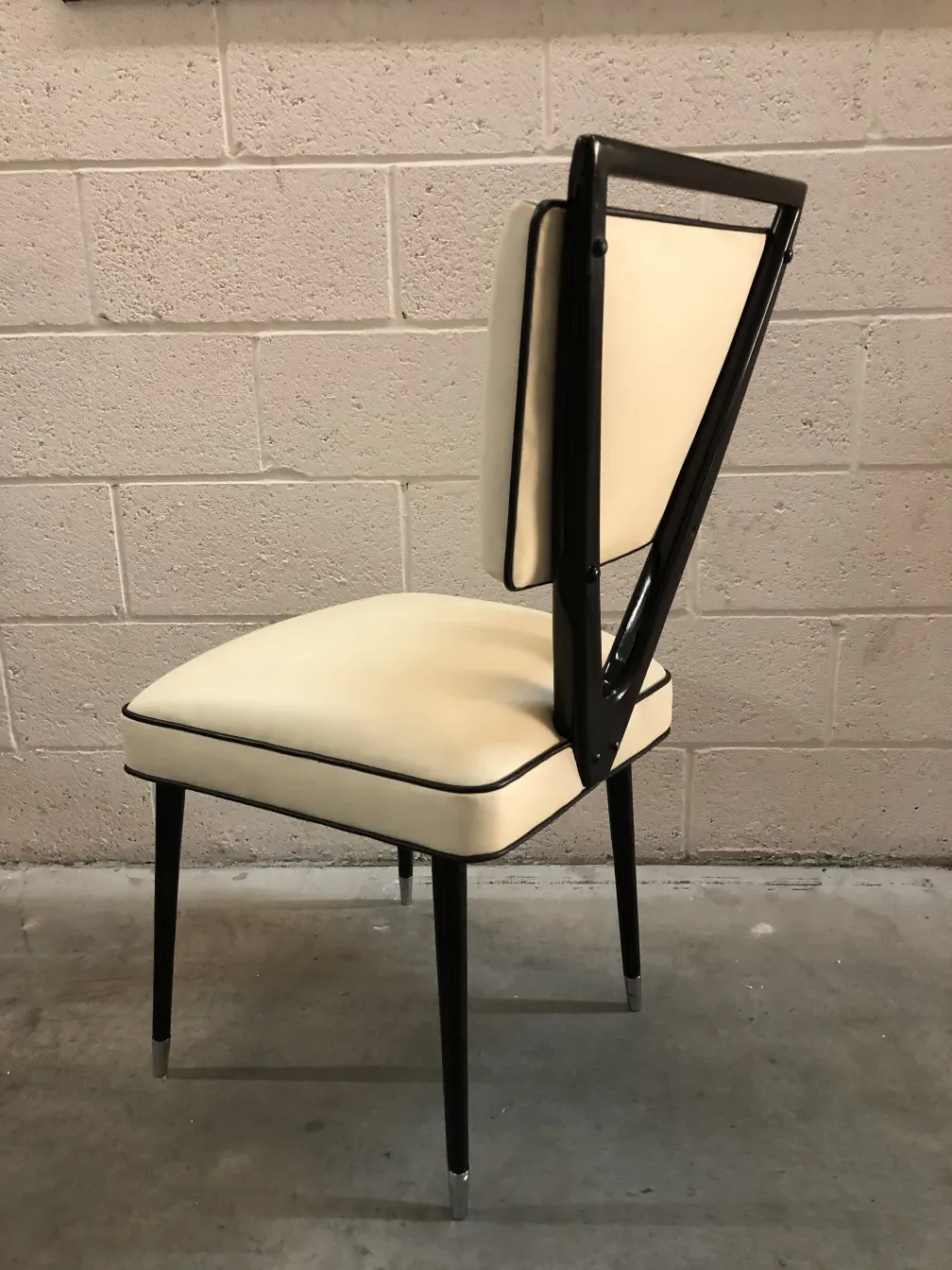 antique 2 chairs with distinctive backrest in a neutral setting