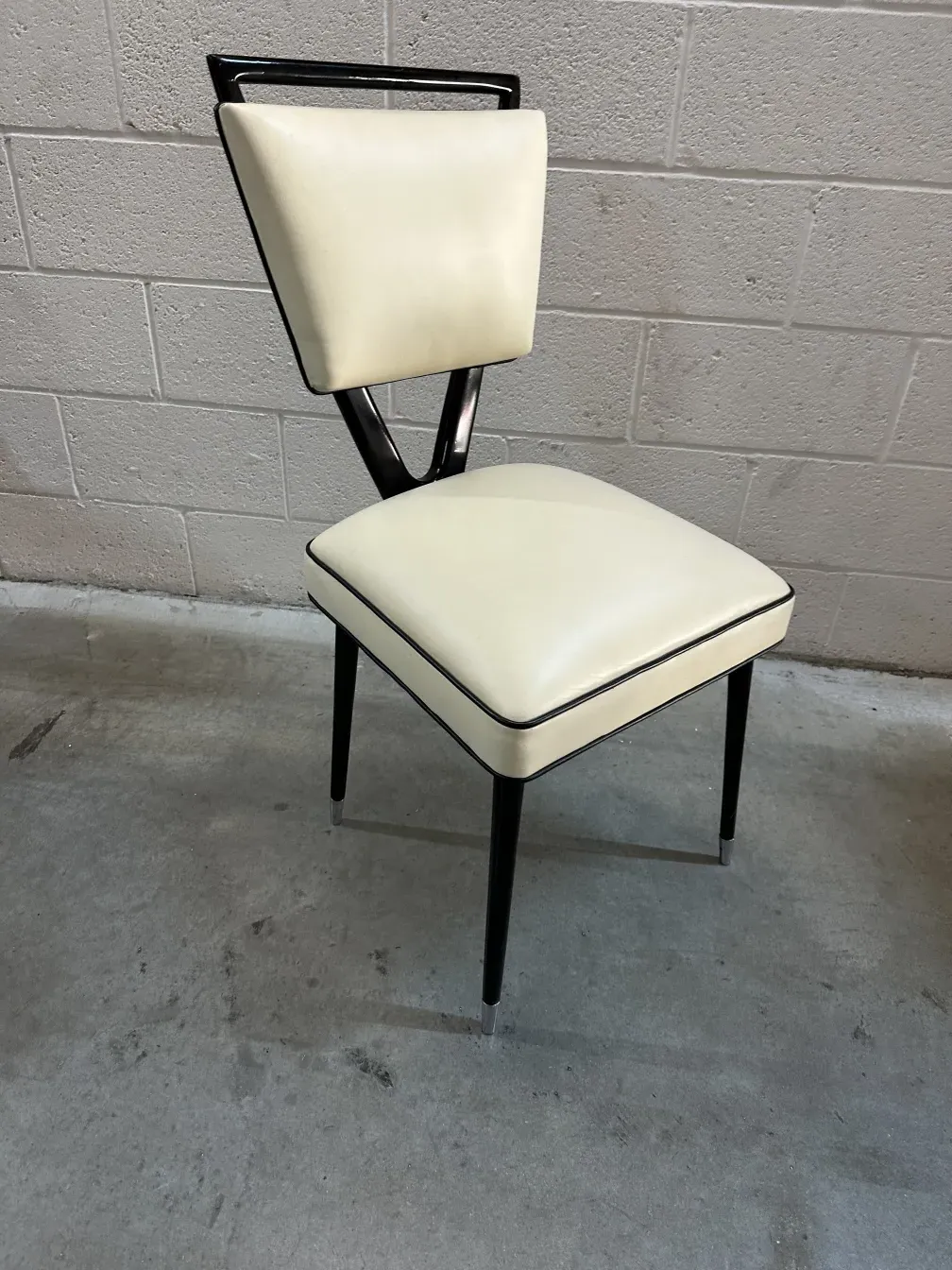 2 antique chairs with a distinctive design in a modern setting