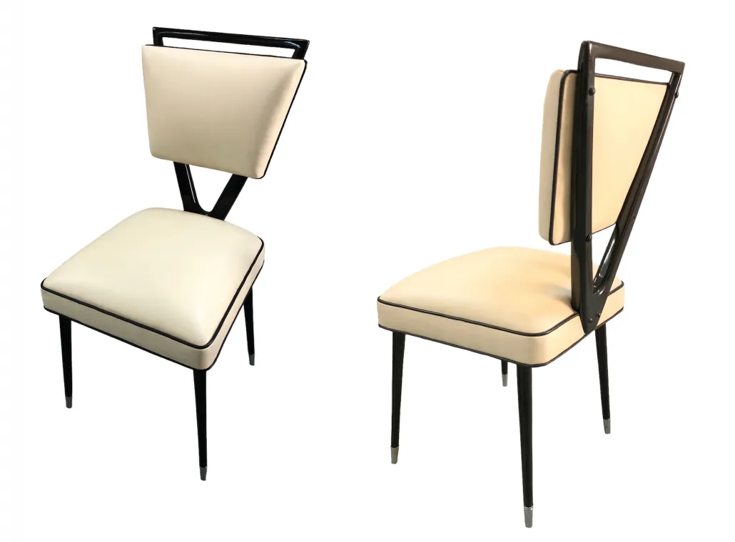 Set of 2 antique chairs with a unique design, carlo mollino, in a classical setting.