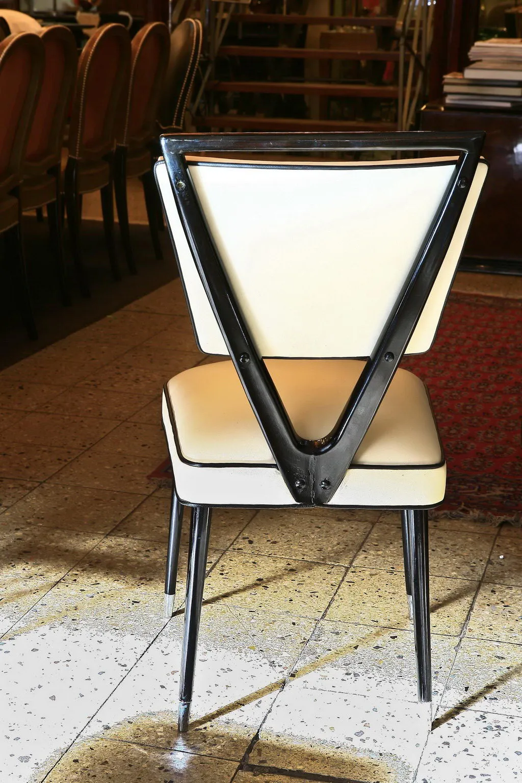 2 antique chairs with V-shaped back design carlo mollino