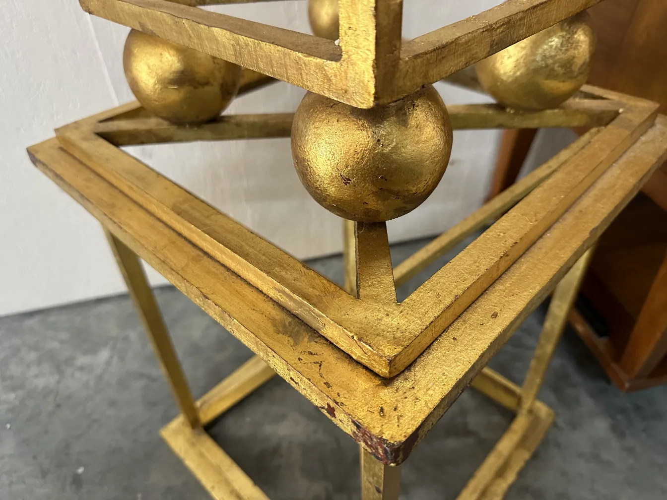 Two antique obelisks with decorative golden details.