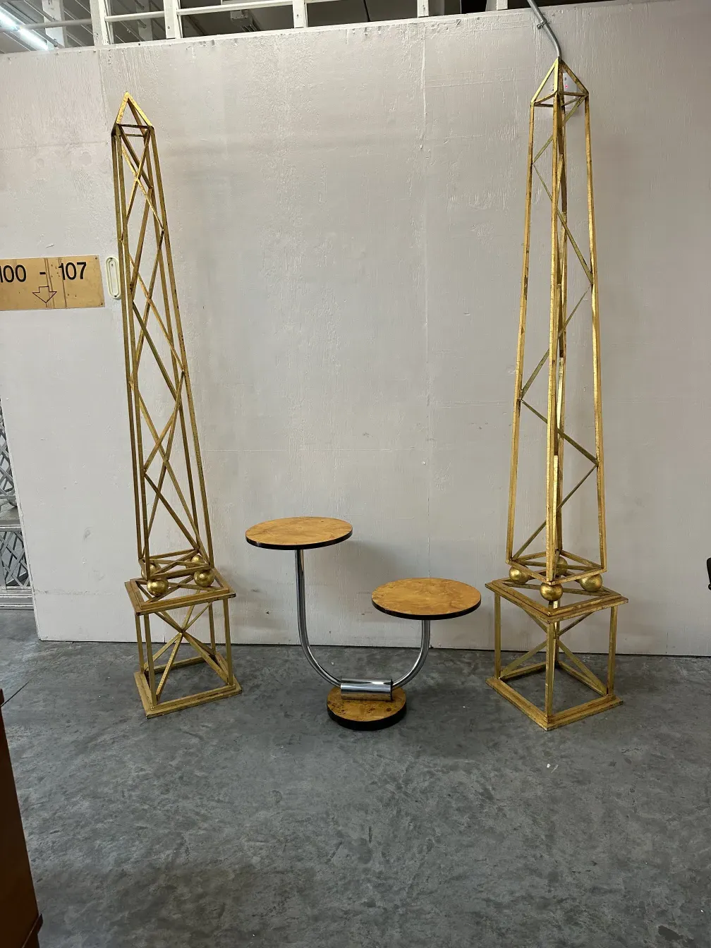 Two antique obelisks in a decorative setting