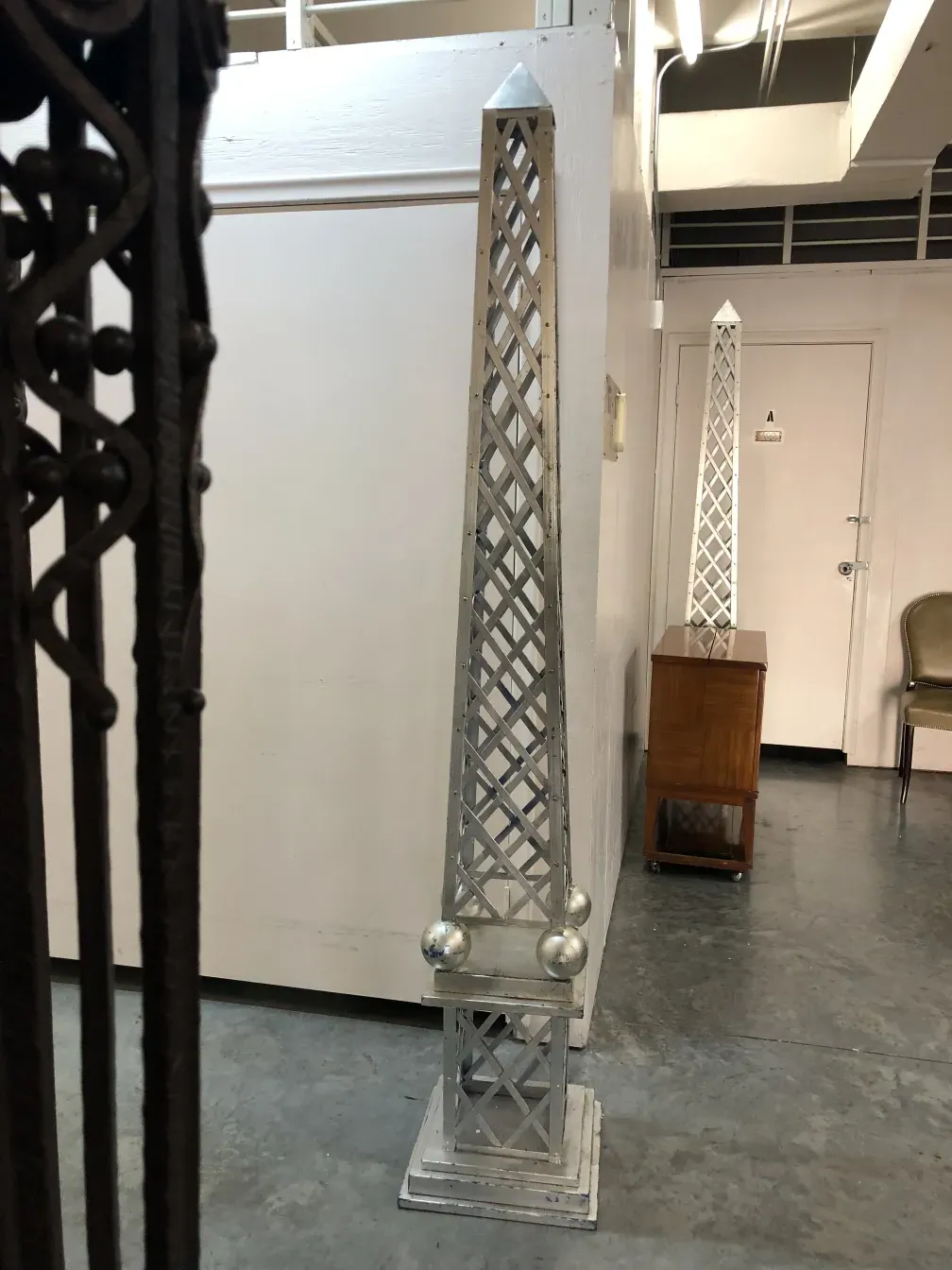 ancient obelisk with decorative design in modern space